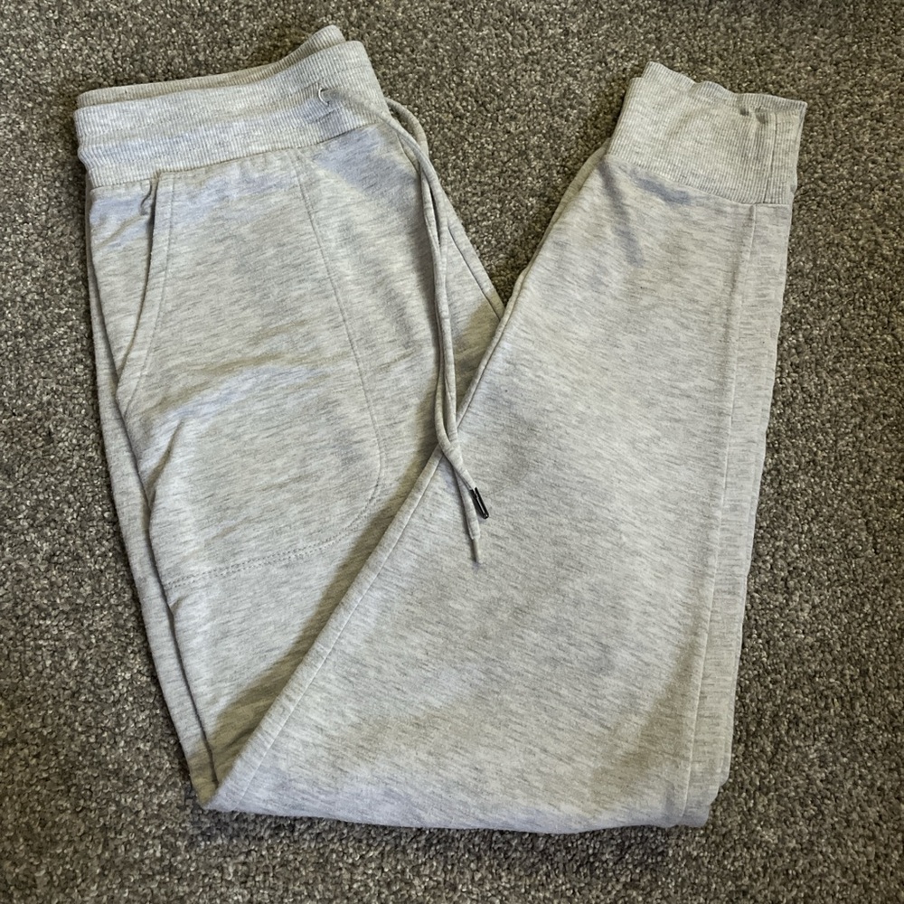 Light grey stars above sweatpants